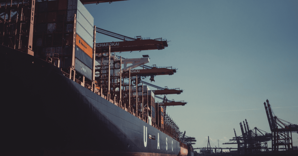 Container cranes transferring shipping containers