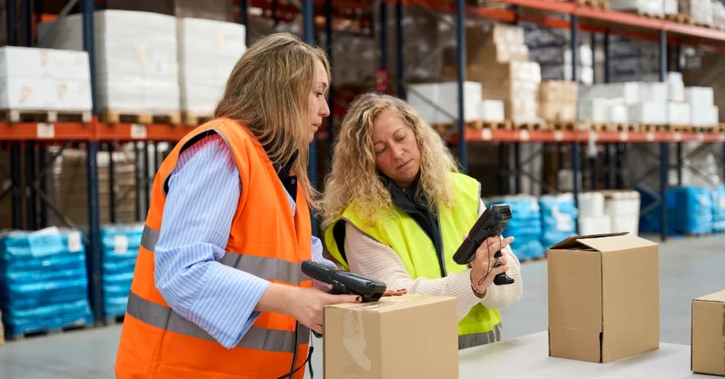 How to Ship to Amazon FBA from China: A Step by Step Guide 2 employee scaning packages at Amazon FBA Warehouse