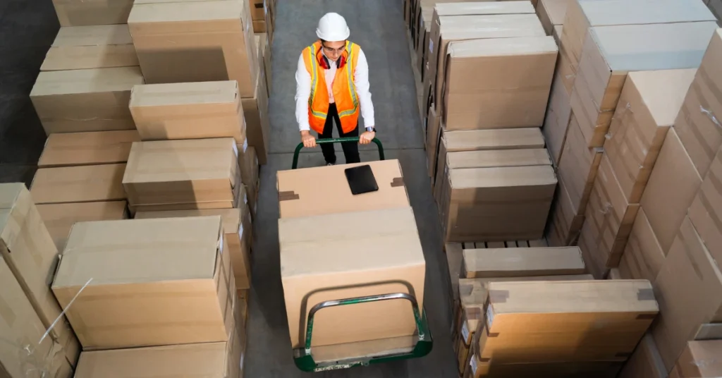 Customs Clearance Procedure: A Complete Guide to Clearing Goods 1 man working in warehouse following customs clearance procedure
